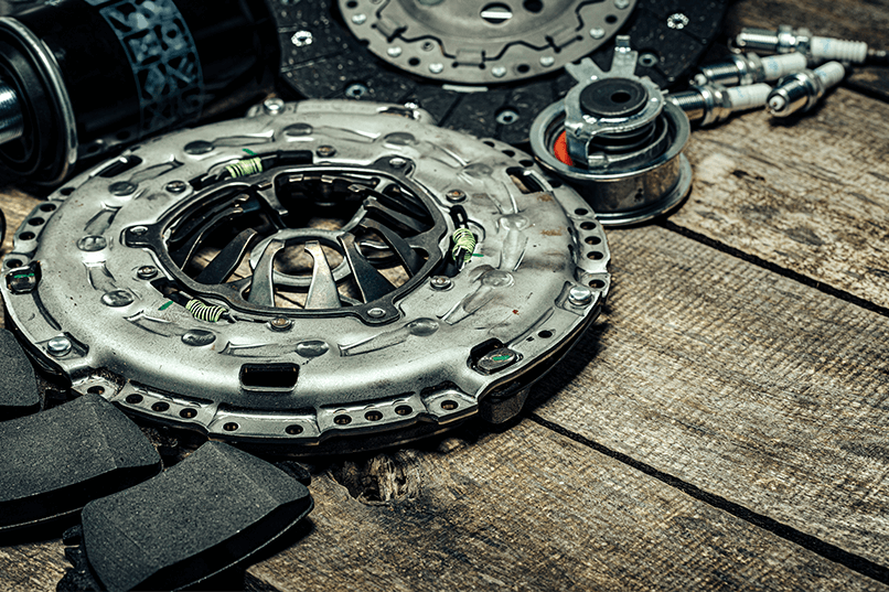 car-parts-set-on-wooden-background-close-up-2025-02-25-13-22-40-utc